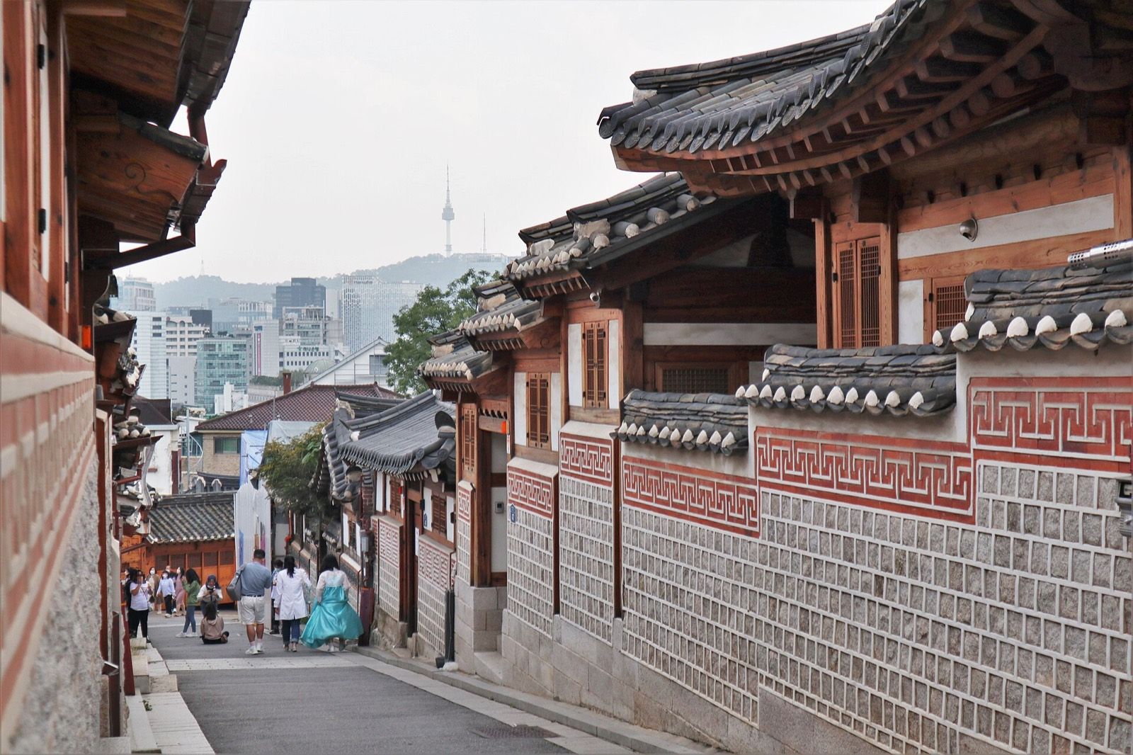 Traditional hanok rooftops in a Bukchon Hanok Village alley