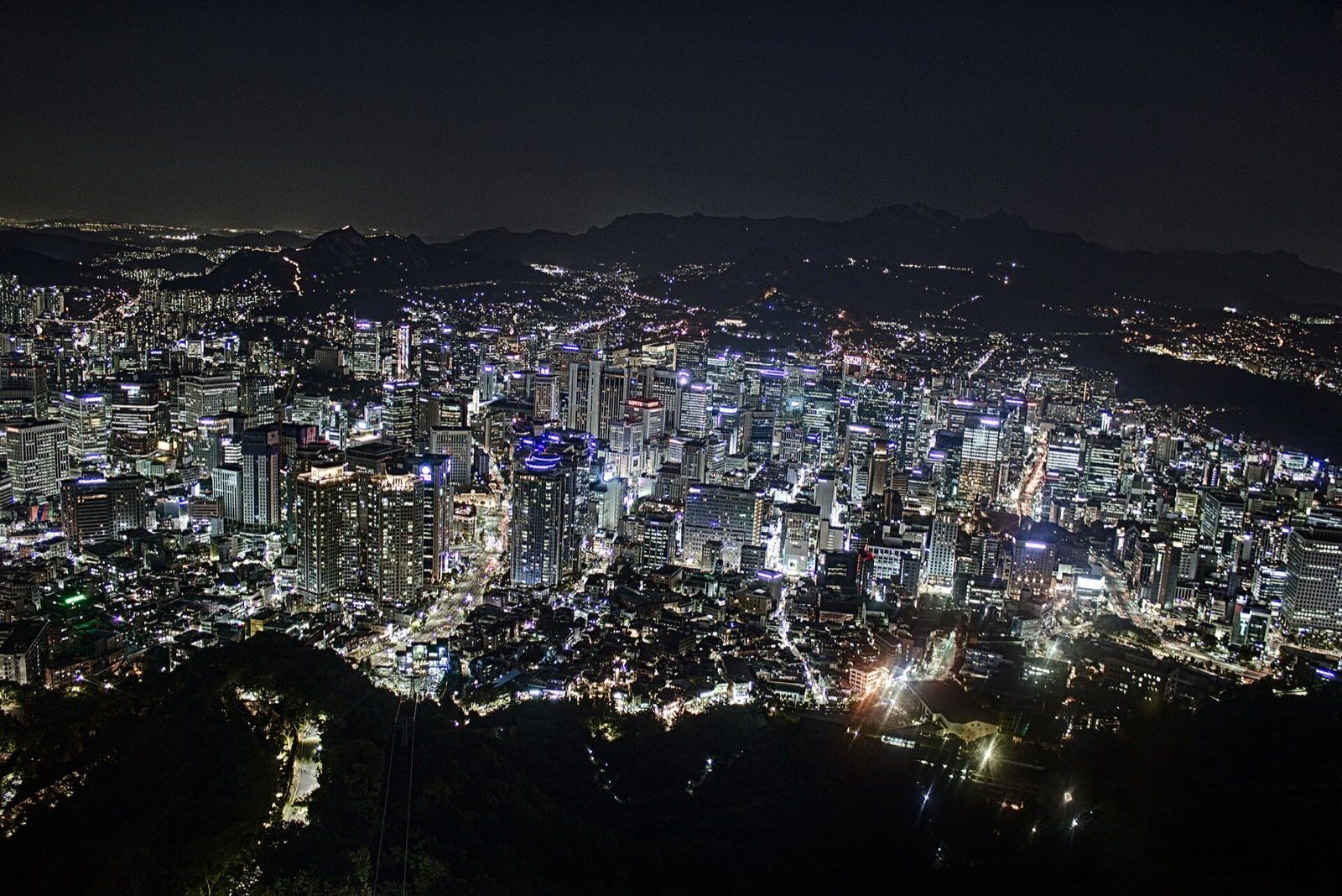 Seoul skyline at night with N Seoul Tower lit on Namsan mountain